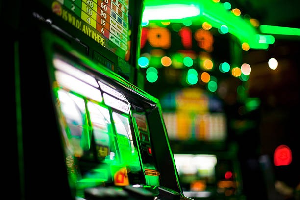 Jurassic Kingdom slot game interface showing dinosaur-themed reels and spin controls